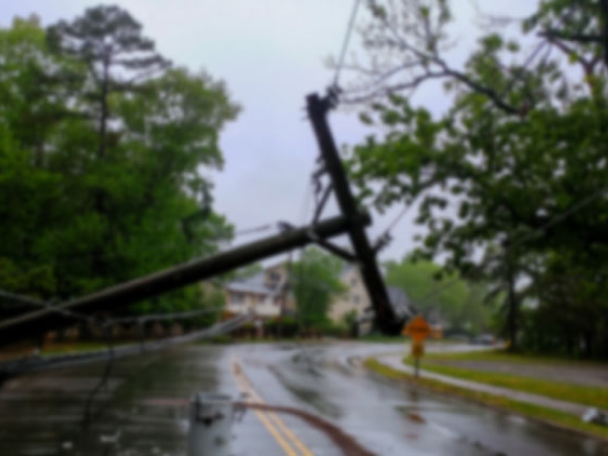 Fallen electrical pole across a street